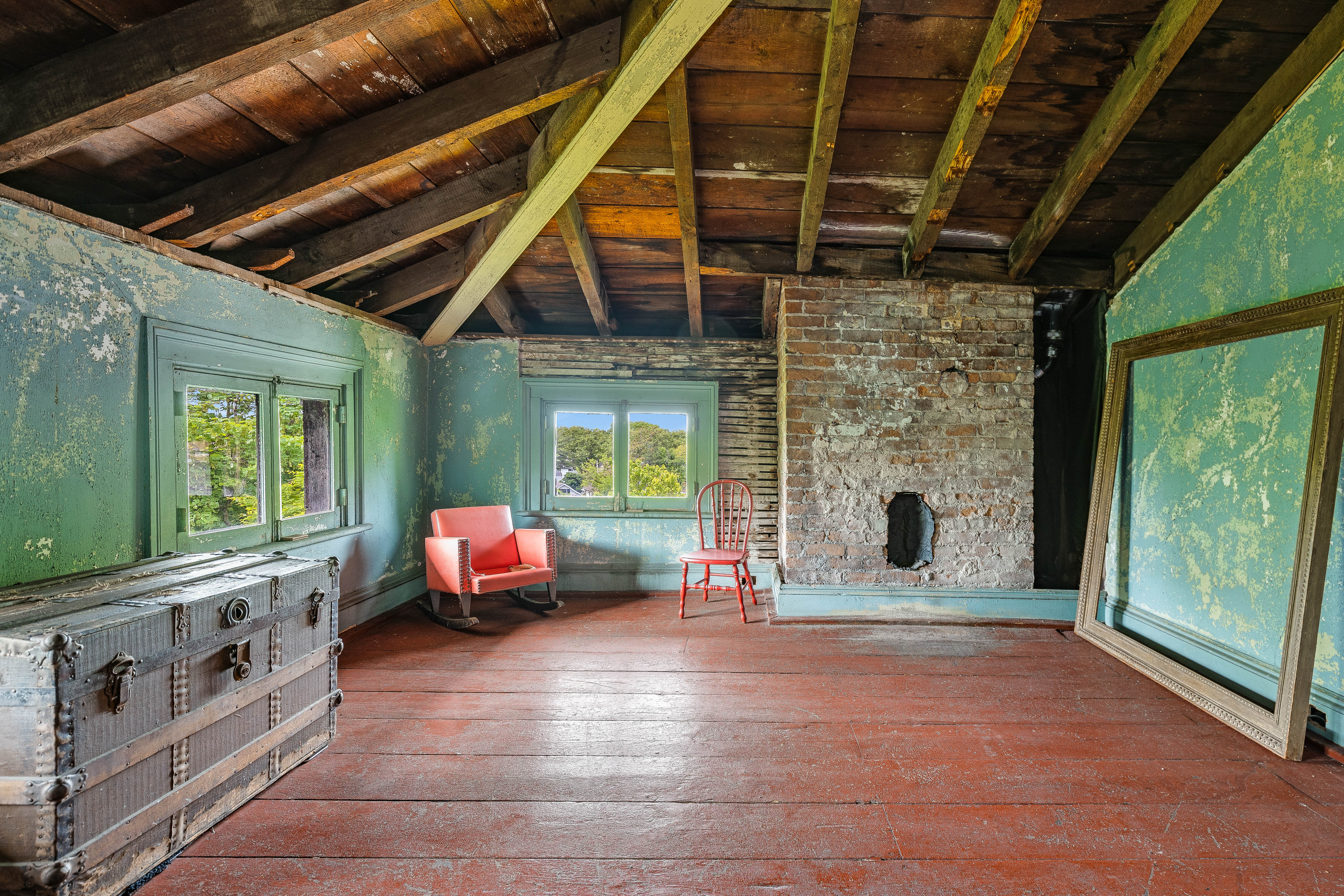 Green attic with vintage trunk