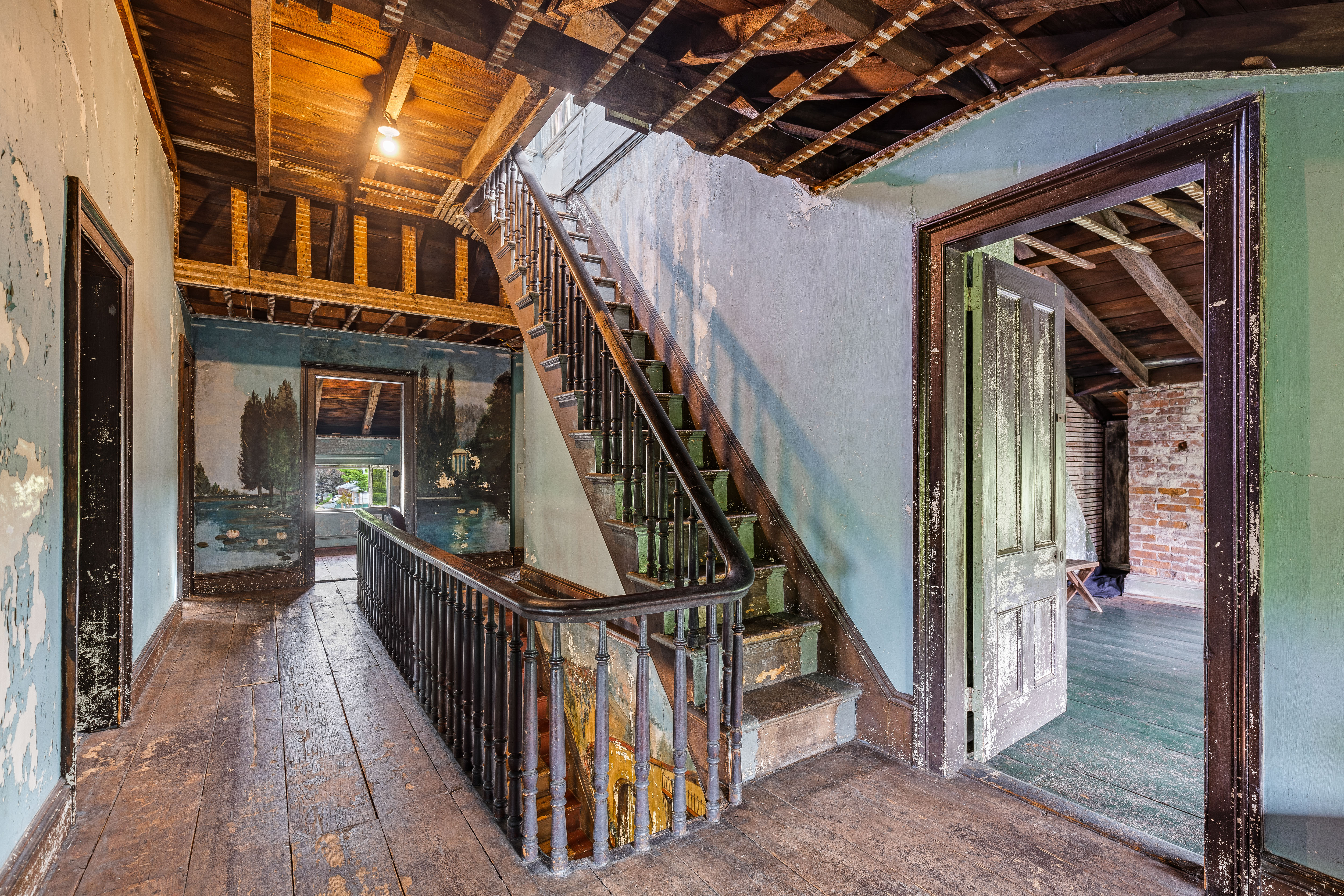 Third floor staircase with mural